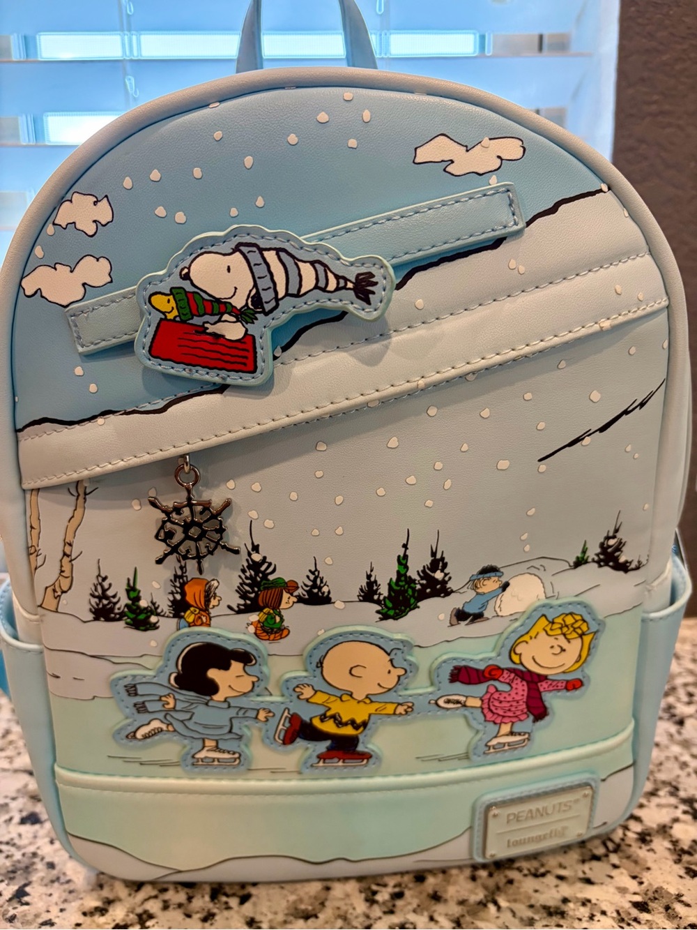 Loungefly Light Blue Peanuts Ice Skating Mini Backpack